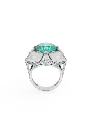 White gold ring with oval green lab grown Zambian emerald center, surrounded by mother of pearl and lab created diamonds in a sculptural floral design on white background