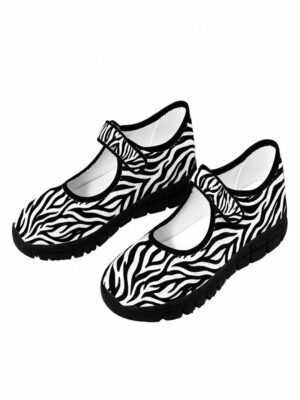 Rich and Rich Black White Zebra Pattern Mary Jane’s with zebra print upper, black trim, Velcro strap, and lightweight black sole.