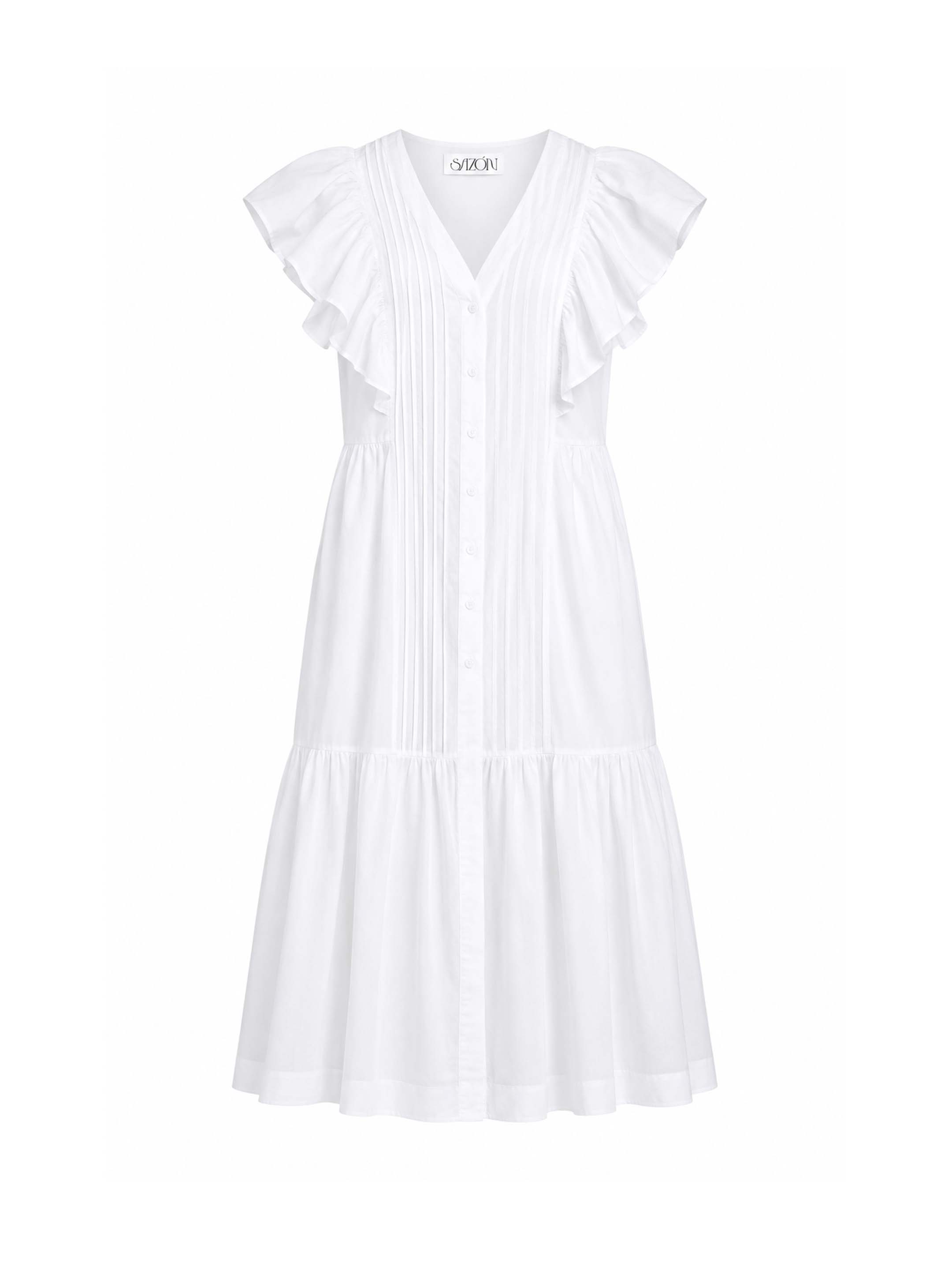White 100% cotton midi dress wit center front button placket and a soft V neckline. It features a tall ruffle at the bottom hem and pintucks along the front panels. It has cascading ruffles at front and back that covers the shoulders.