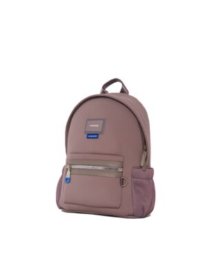 Three-quarter view of mauve neoprene mini backpack with maisonje logo patch and cobalt-blue zipper puller