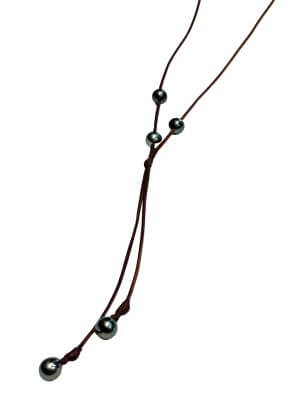 Necklace with five Tahitian pearls set on hand-rolled leather, two beads hanging at the back.