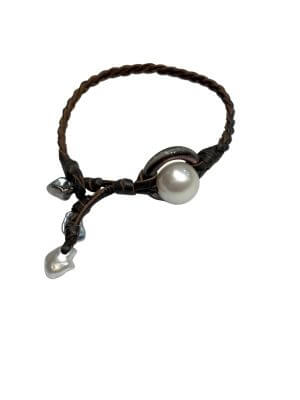 Bracelet with twelve 11 mm Tahitian pearls mounted on a hand-rolled leather band.
