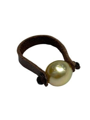 Ring featuring a single 9 mm Australian golden pearl on a hand-rolled leather band.