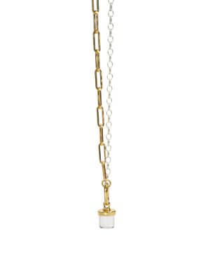 Close-up of a bi-color necklace made of two contrasting chains in silver and gold tones, adorned with a clear quartz charm and an elegant clip for interchangeable crystal charms.