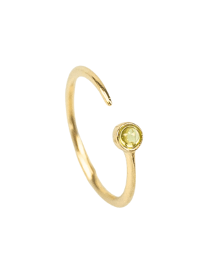 Close-up of a delicate gold-plated sterling silver ring in a feminine, curved shape, adorned with a vibrant green peridot gemstone.