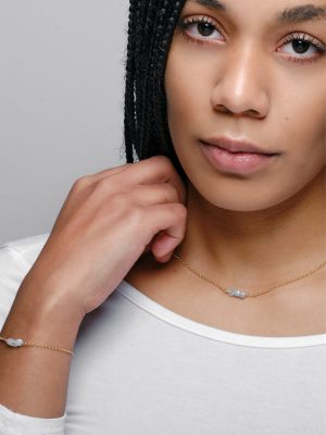 Gold-plated sterling silver fine chain necklace with aquamarine crystal pendant, handcrafted from recycled materials, symbolizing calm, courage, and flow.