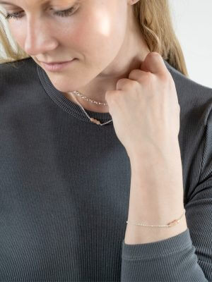 Delicate sterling silver bracelet with three moonstone beads, symbolizing intuition and feminine energy.