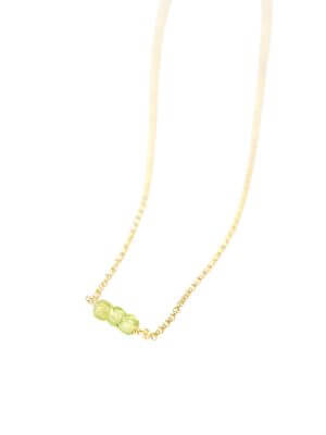 Gold-plated sterling silver fine chain necklace with green peridot crystal pendant, handcrafted from recycled materials, symbolizing growth, renewal, and fresh energy.